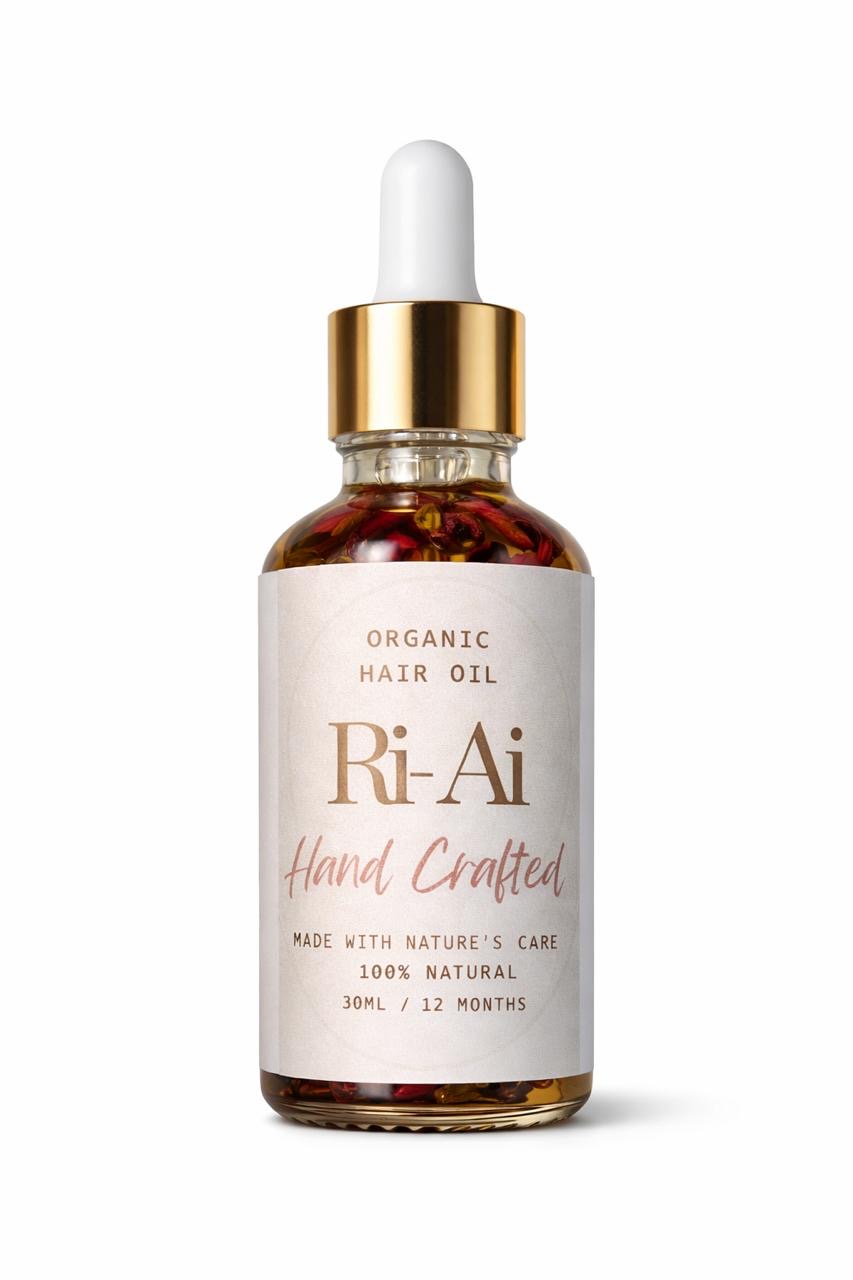 Amber glass bottle of herbal hair oil with rosemary and hibiscus